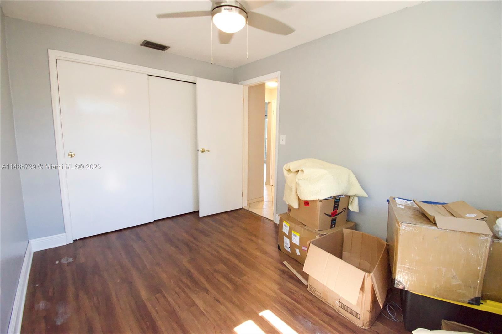 6560 Northwest 30th Street Sunrise, FL 33313 - Photo 38 of 46 a view of a room with wooden floor table and chair
