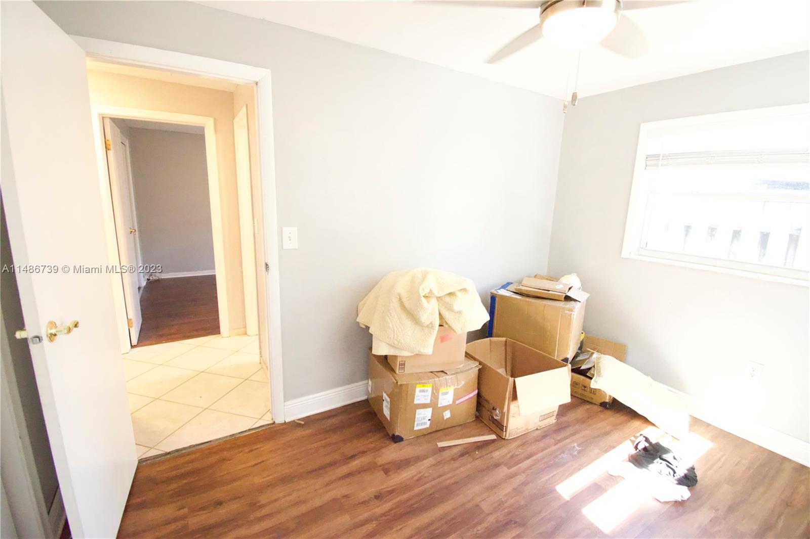 6560 Northwest 30th Street Sunrise, FL 33313 - Photo 39 of 46 a living room with furniture and a window