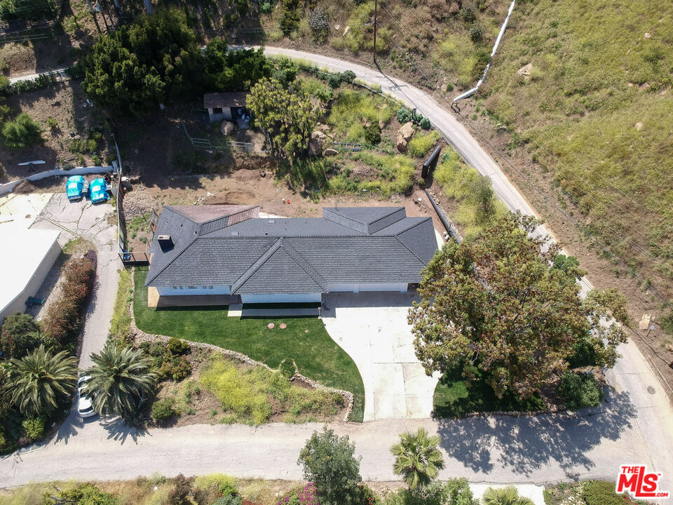 20490 Seaboard Road Malibu, CA 90265 - Photo 15 of 50 a view of a house with a yard