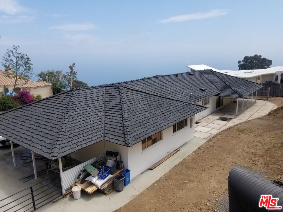 20490 Seaboard Road Malibu, CA 90265 - Photo 47 of 50 a roof deck with table and chairs