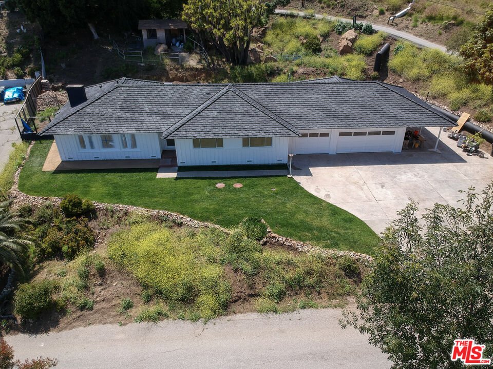 20490 Seaboard Road Malibu, CA 90265 - Photo 5 of 50 a aerial view of a house with a yard and large tree