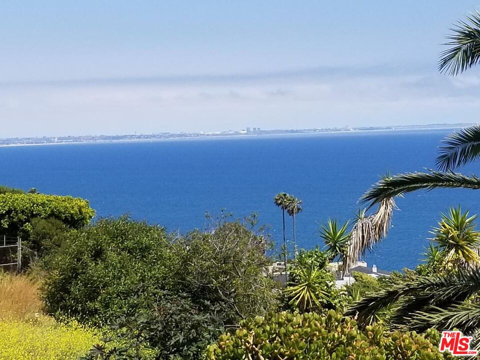 20490 Seaboard Road Malibu, CA 90265 - Photo 6 of 50 an aerial view of a house with a yard and lake view