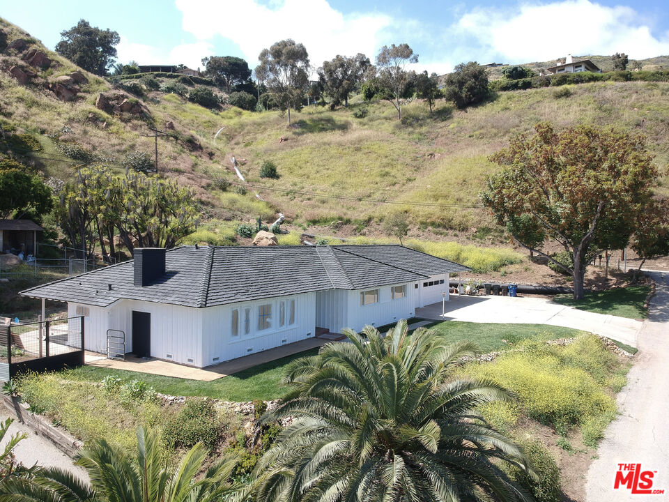 20490 Seaboard Road Malibu, CA 90265 - Photo 7 of 50 a view of a house with a yard