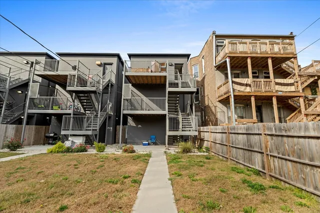 a view of a house with wooden stairs