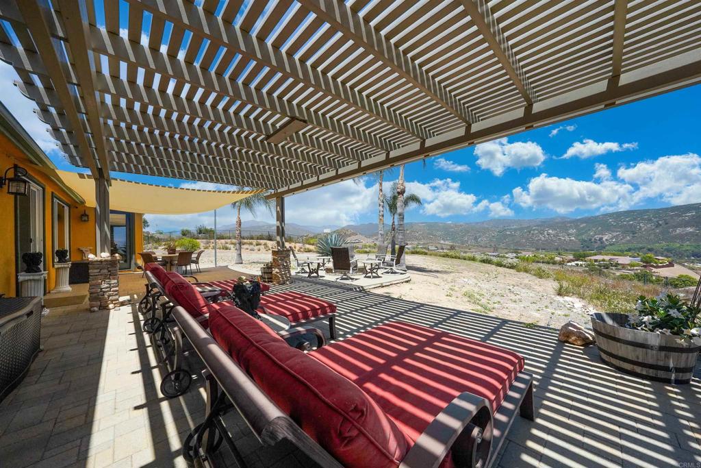 22963 Stokes Road Ramona, CA 92065 - Photo 10 of 57 a view of a patio with wooden floor