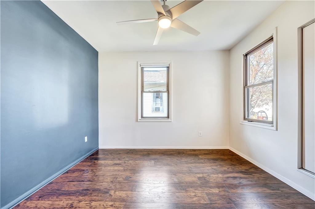 5504 Jane Pittsburgh, PA 15225 - Photo 11 of 27 a view of an empty room with wooden floor and a window