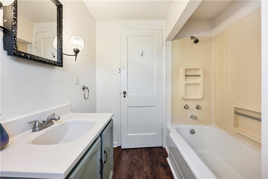 5504 Jane Pittsburgh, PA 15225 - Photo 15 of 27 a bathroom with a tub sink and mirror