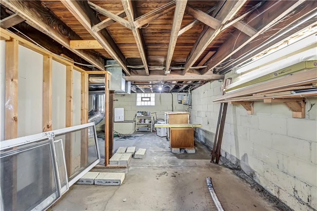 5504 Jane Pittsburgh, PA 15225 - Photo 19 of 27 a view of a garage room with wooden chairs