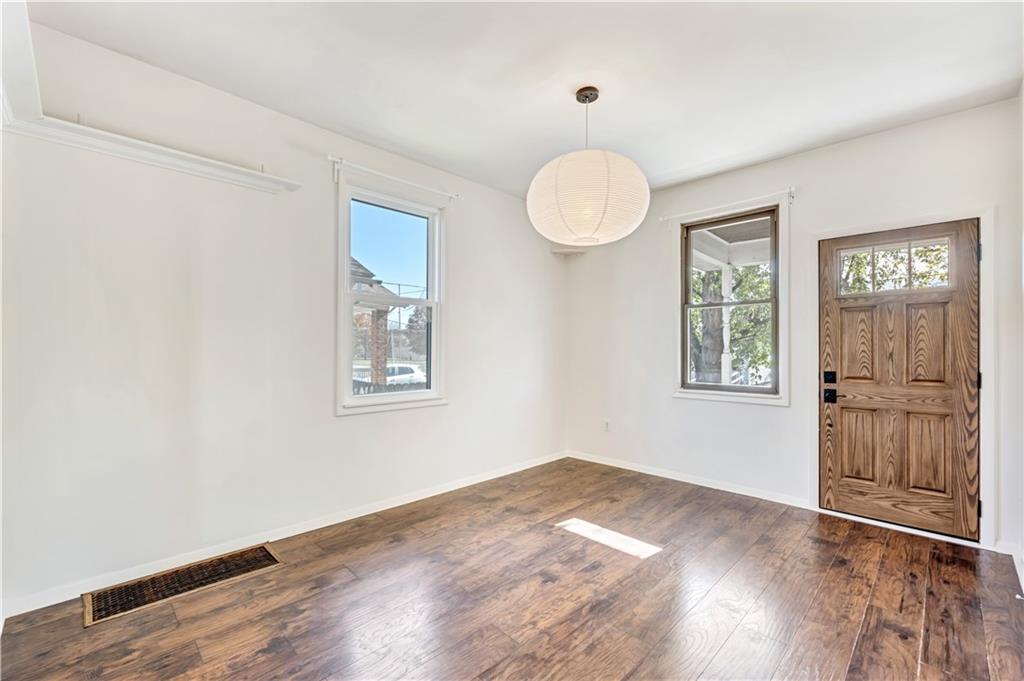 5504 Jane Pittsburgh, PA 15225 - Photo 5 of 27 a view of an empty room with wooden floor and a window