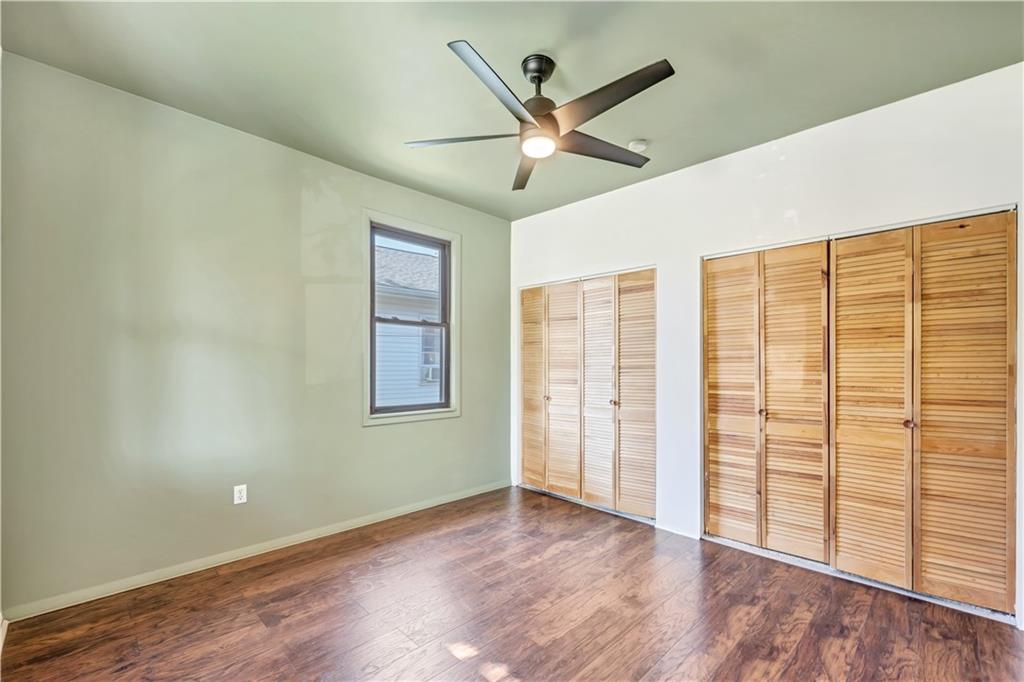 5504 Jane Pittsburgh, PA 15225 - Photo 6 of 27 an empty room with wooden floor fan and windows