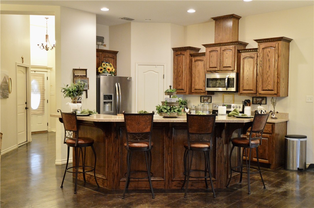 1717 Agarito Avenue Alice, TX 78332 - Photo 18 of 25 a view of dining table and chairs