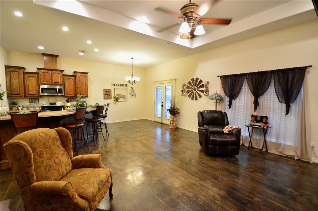 1717 Agarito Avenue Alice, TX 78332 - Photo 21 of 25 a living room with furniture and kitchen view
