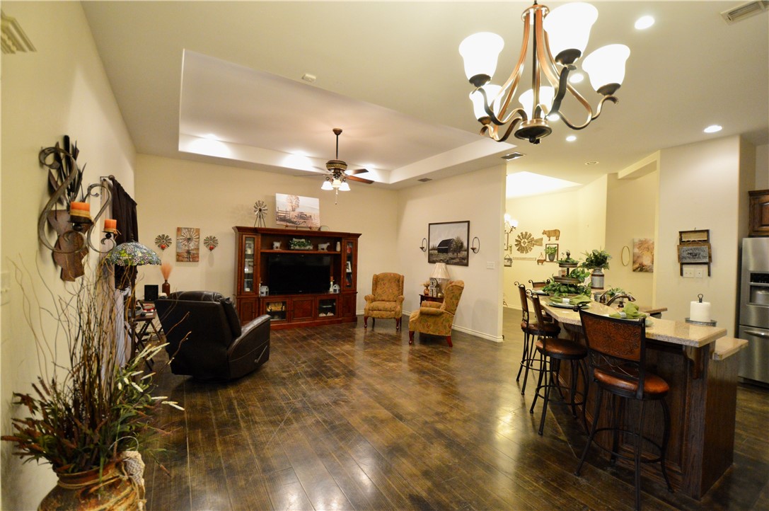 1717 Agarito Avenue Alice, TX 78332 - Photo 22 of 25 a view of a dining room with furniture and a chandelier