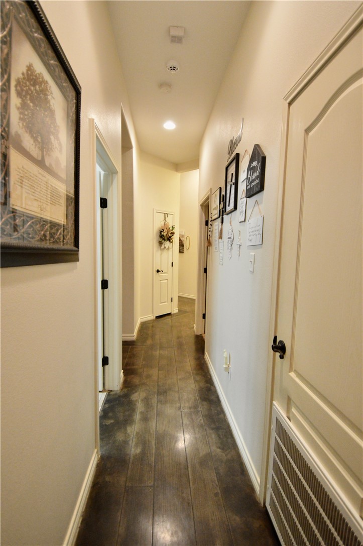 1717 Agarito Avenue Alice, TX 78332 - Photo 8 of 25 a view of a hallway with wooden floor and staircase