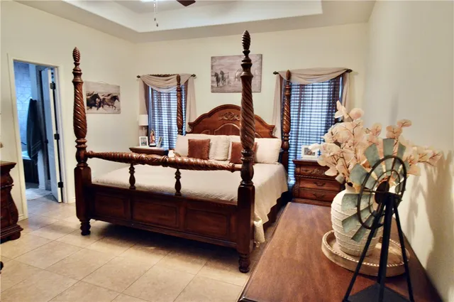 a bedroom with furniture and wooden floor