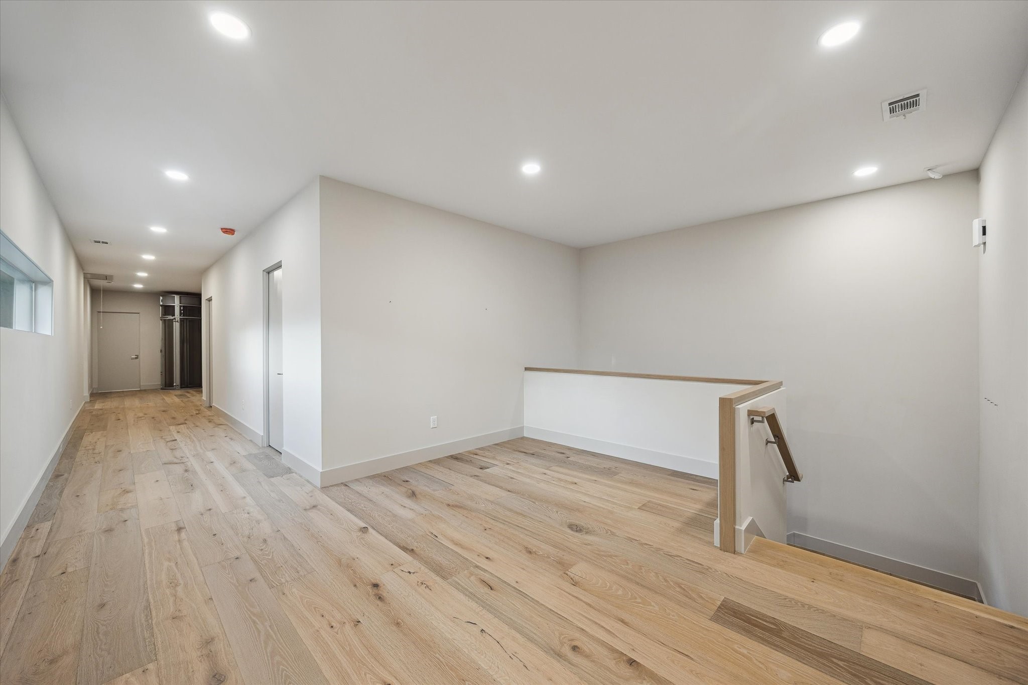 2129 Quenby Street Houston, TX 77005 - Photo 26 of 39 a view of empty room with wooden floor