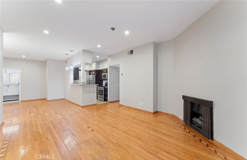 4705 Kester Avenue, Unit 209 Sherman Oaks, CA 91403 - Photo 11 of 18 a view of empty room with wooden floor