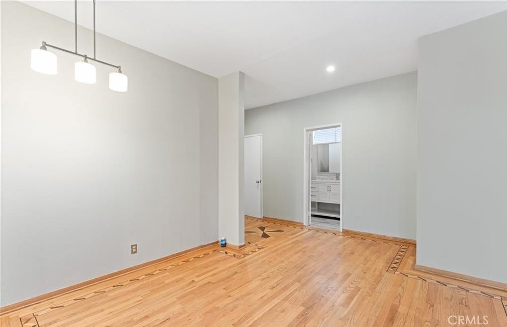 4705 Kester Avenue, Unit 209 Sherman Oaks, CA 91403 - Photo 8 of 18 a view of empty room with wooden floor