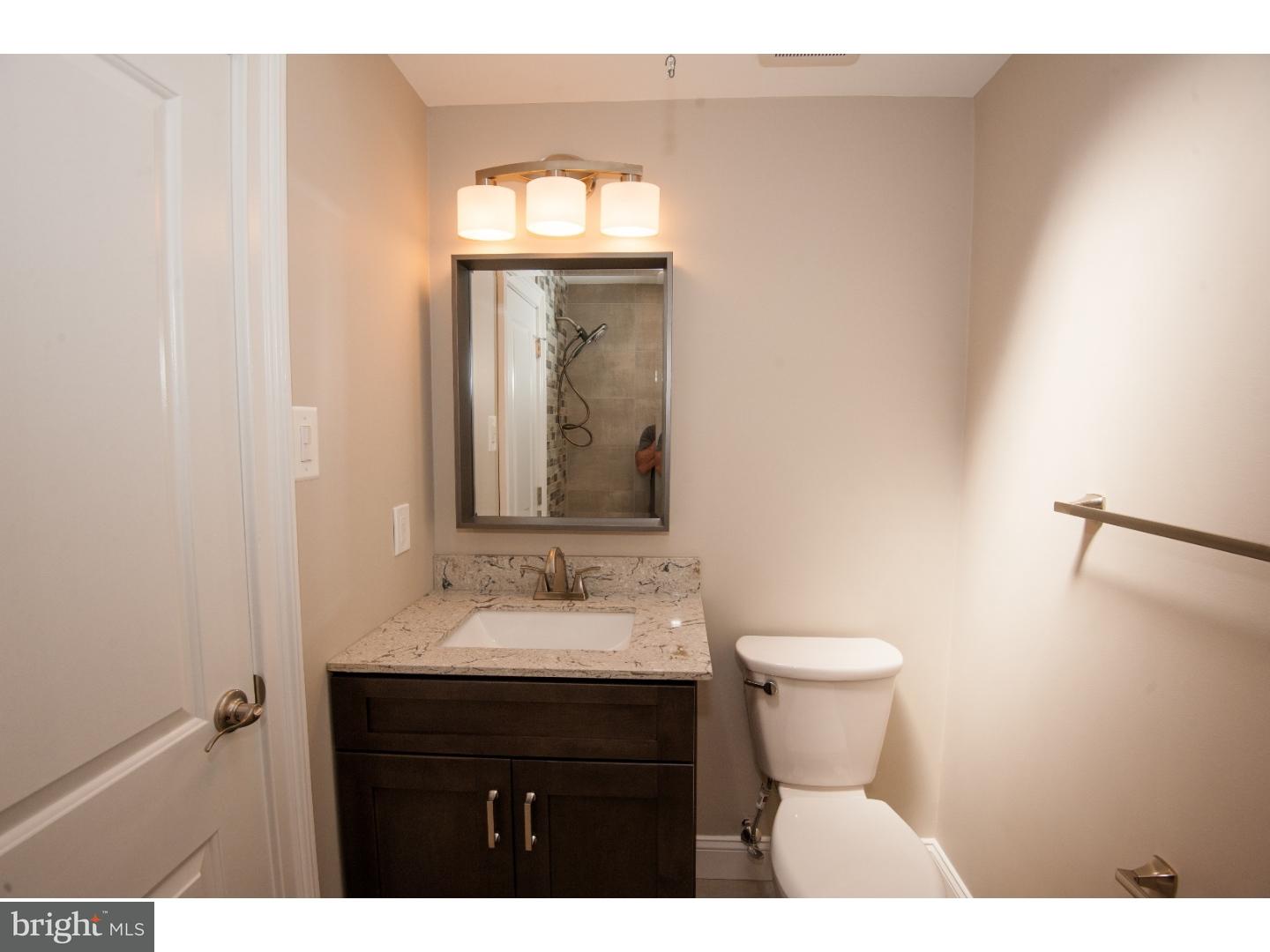 3302 Gurley Road Philadelphia, PA 19154 - Photo 11 of 25 a bathroom with a sink and a mirror
