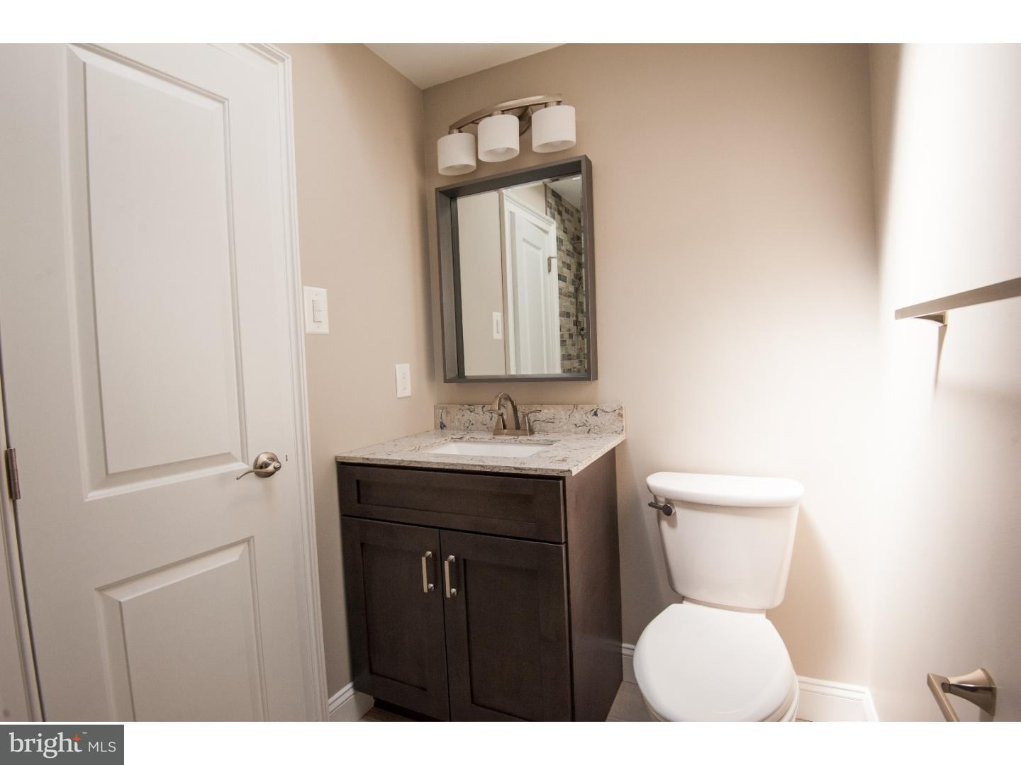 3302 Gurley Road Philadelphia, PA 19154 - Photo 12 of 25 a bathroom with a toilet sink shower and mirror