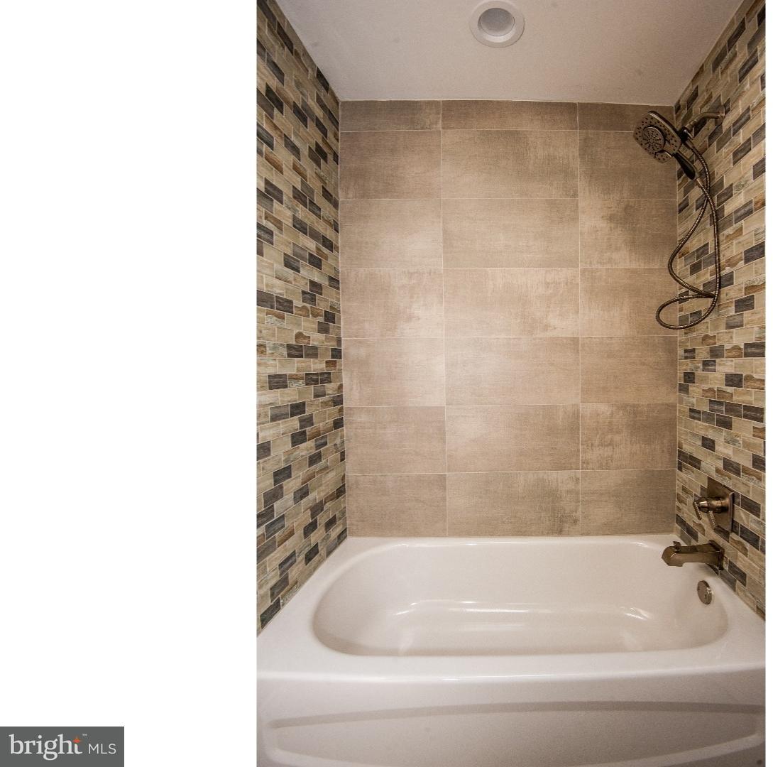 3302 Gurley Road Philadelphia, PA 19154 - Photo 13 of 25 a bathroom with a bathtub and shower