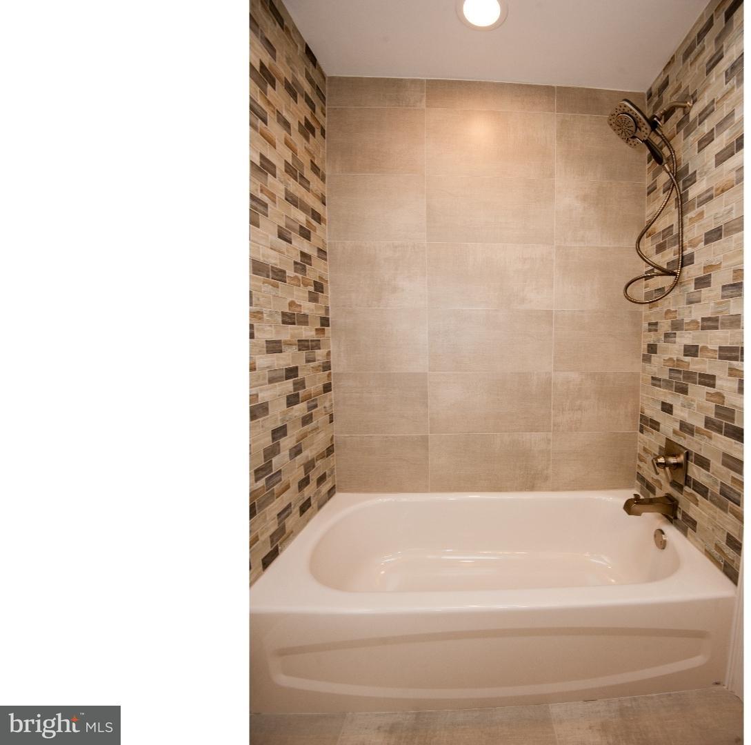 3302 Gurley Road Philadelphia, PA 19154 - Photo 14 of 25 a bathroom with a bathtub and shower