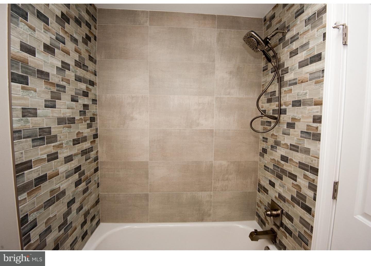 3302 Gurley Road Philadelphia, PA 19154 - Photo 15 of 25 a bathroom with a shower curtain