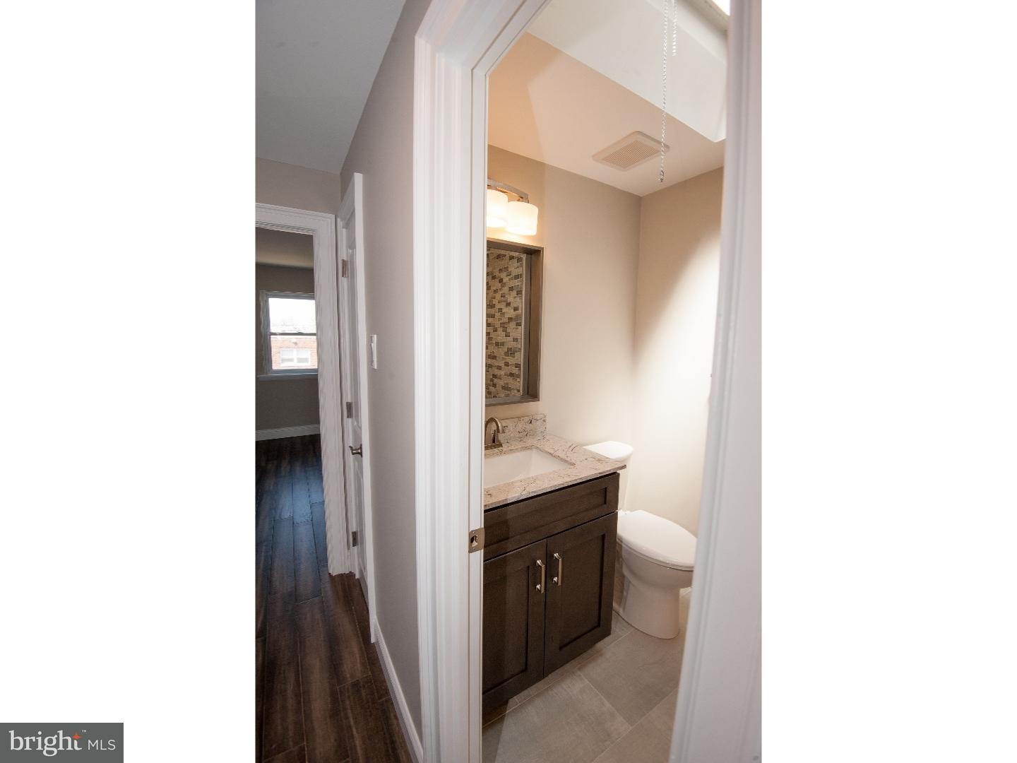 3302 Gurley Road Philadelphia, PA 19154 - Photo 16 of 25 a en suite bathroom with a sink and a mirror