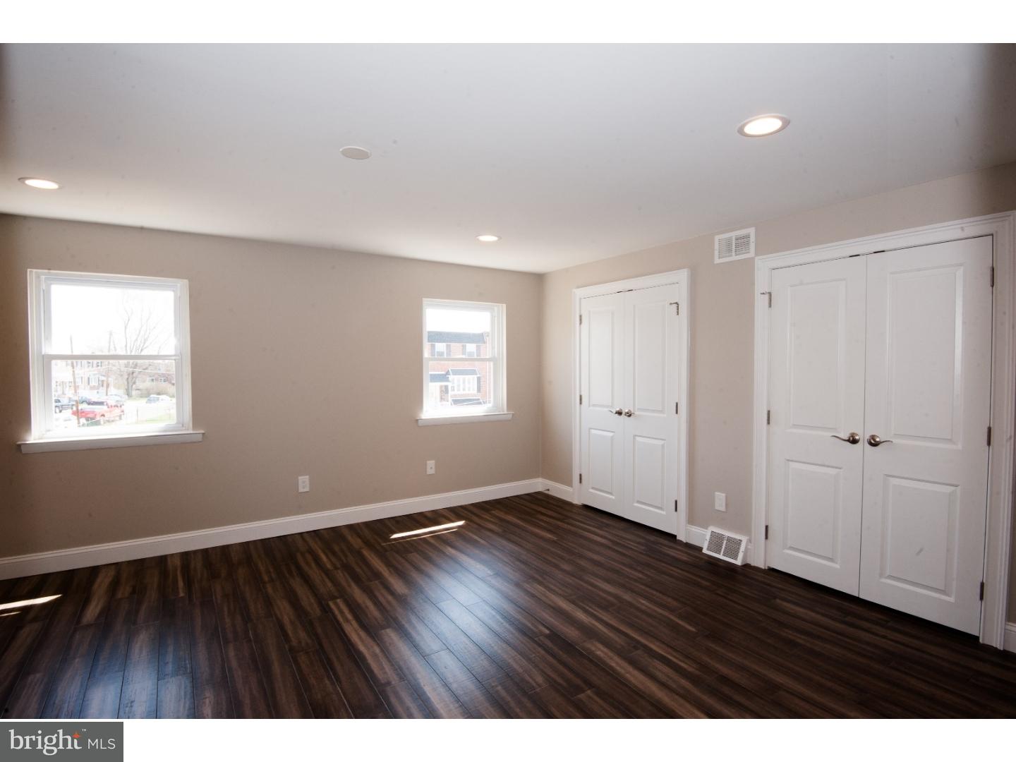 3302 Gurley Road Philadelphia, PA 19154 - Photo 18 of 25 a view of an empty room with wooden floor and a window