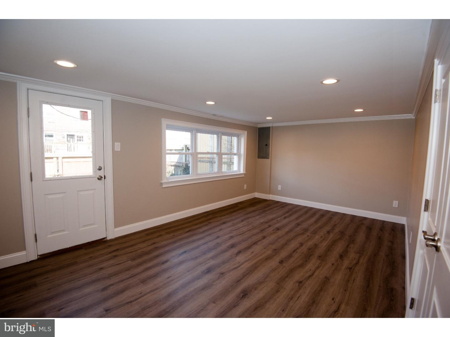 3302 Gurley Road Philadelphia, PA 19154 - Photo 22 of 25 a view of an empty room with wooden floor and a window