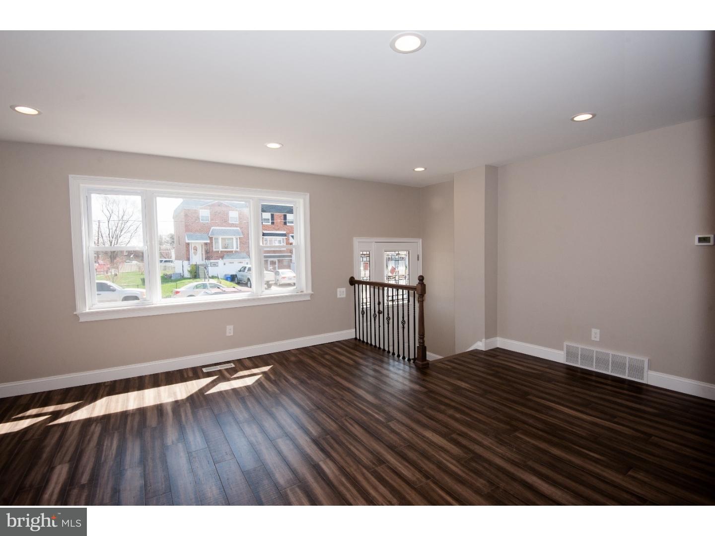 3302 Gurley Road Philadelphia, PA 19154 - Photo 8 of 25 an empty room with wooden floor and windows