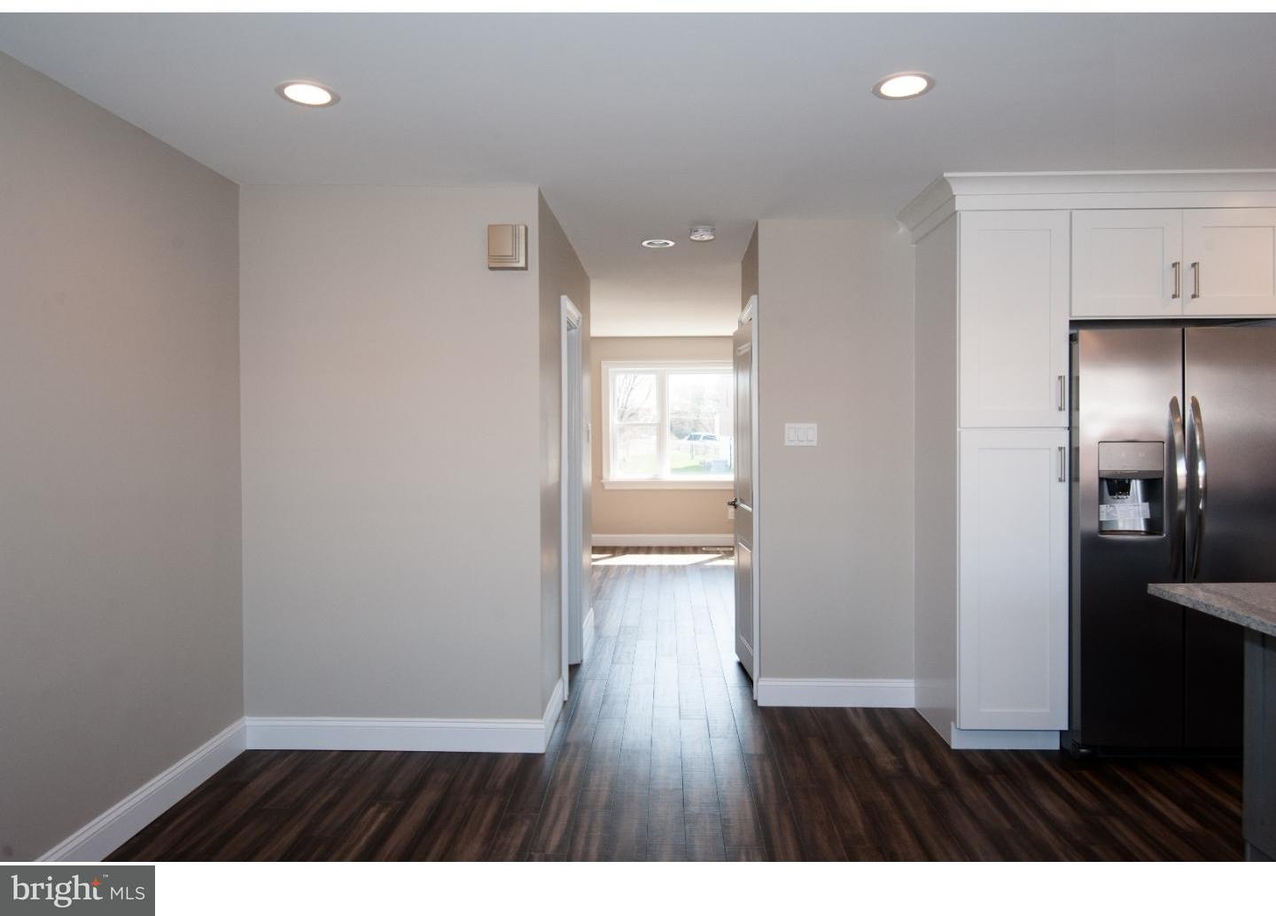 3302 Gurley Road Philadelphia, PA 19154 - Photo 9 of 25 a view of an empty room with wooden floor and a window
