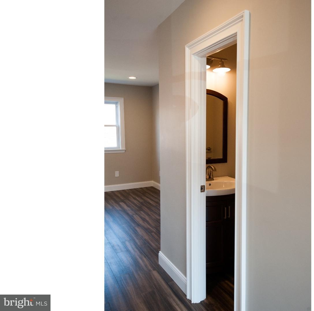 3302 Gurley Road Philadelphia, PA 19154 - Photo 10 of 25 a view of a bathroom from a hallway