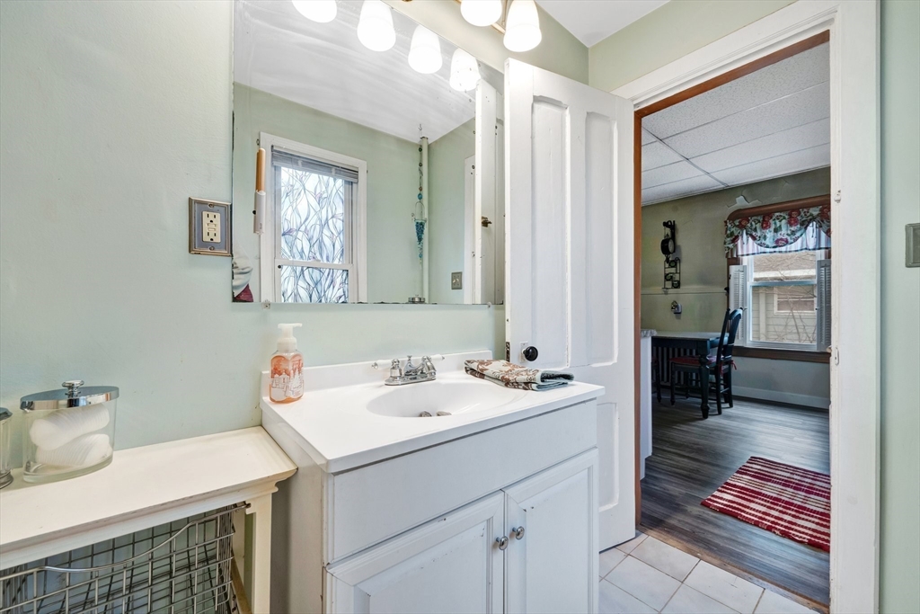 62 Fargo Street Springfield, MA 01119 - Photo 14 of 38 a bathroom with a sink and a mirror