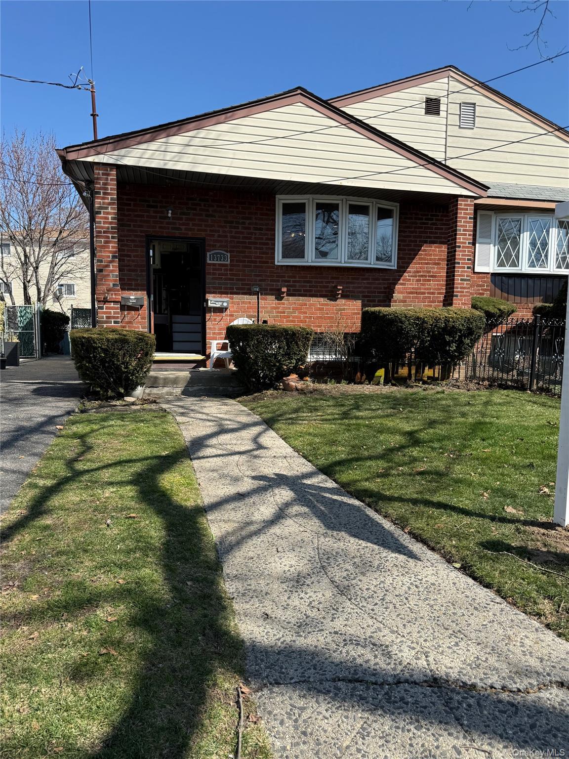 137-33 158th Street Queens, NY 11434 - Photo 1 of 21 a front view of a house with garden