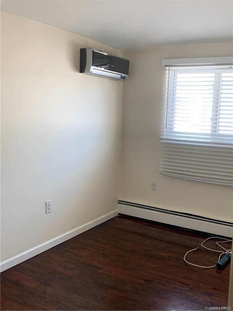 137-33 158th Street Queens, NY 11434 - Photo 12 of 21 a view of a room with wooden floor and a window