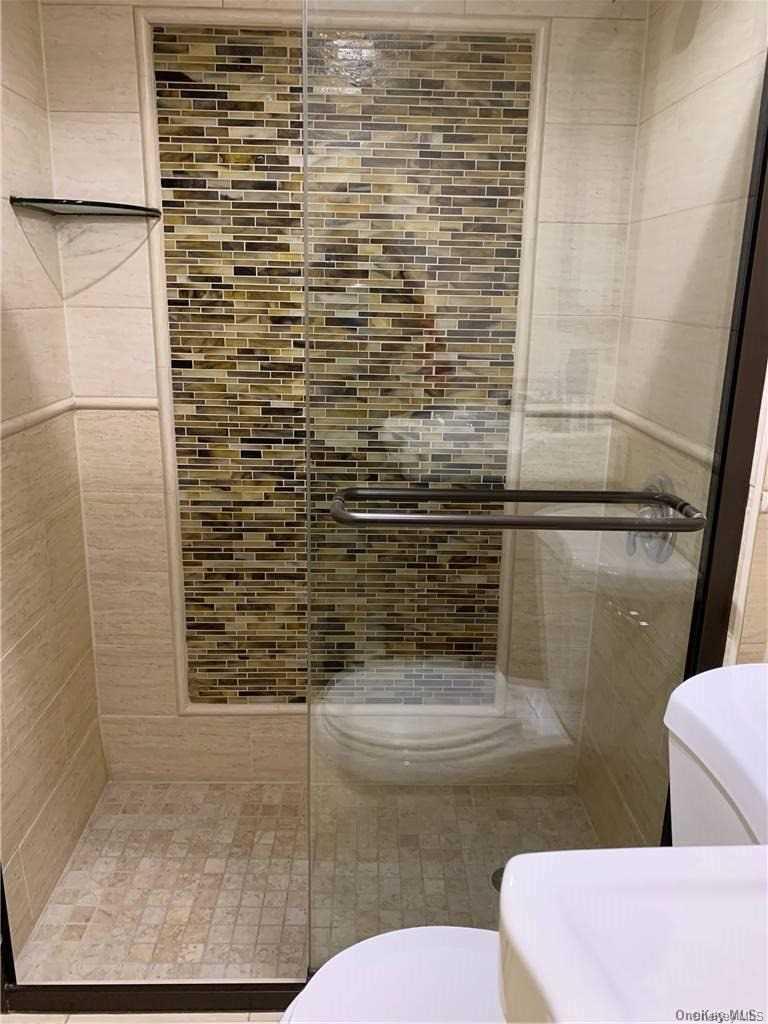 137-33 158th Street Queens, NY 11434 - Photo 14 of 21 a bathroom with a toilet and a shower