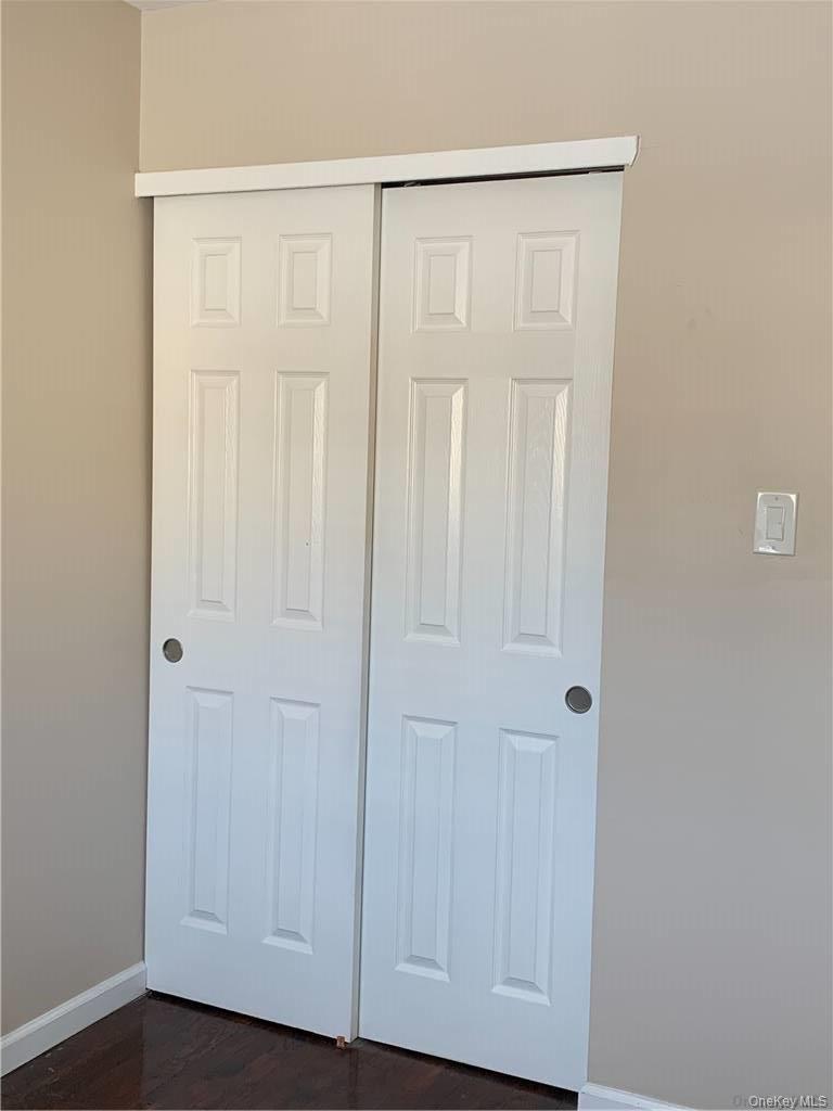 137-33 158th Street Queens, NY 11434 - Photo 15 of 21 an empty room with wooden floor and closet area