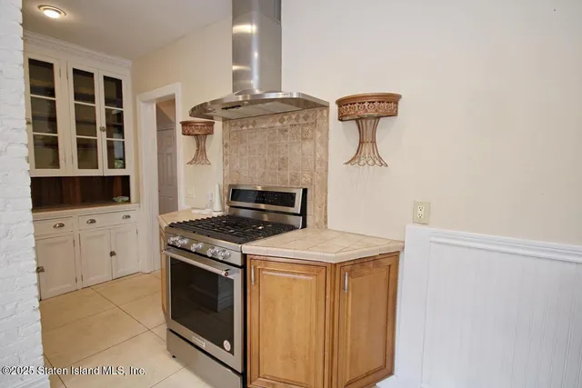 a kitchen with cabinets and appliances