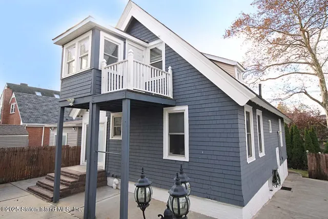 a front view of a house with a balcony