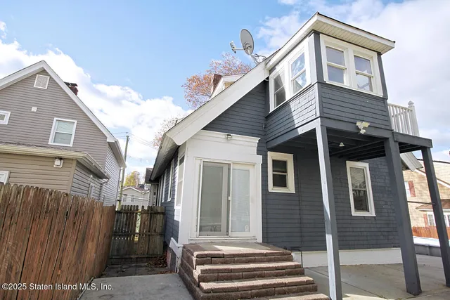 a side view of a house with street