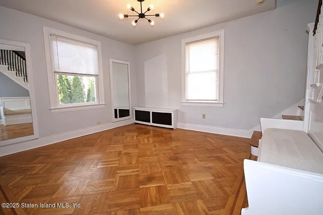 a view of an empty room with a window