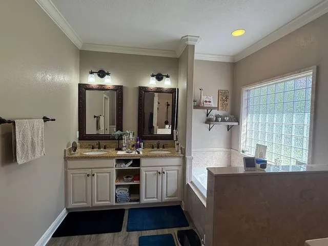 a bathroom with a bathtub and a shower