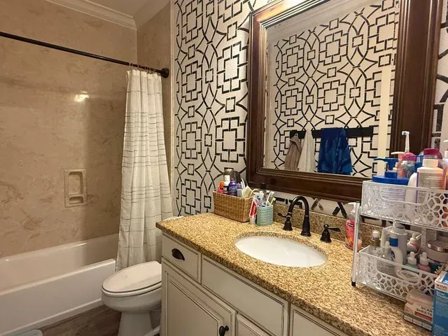 a living room with lots of furniture and a book shelf