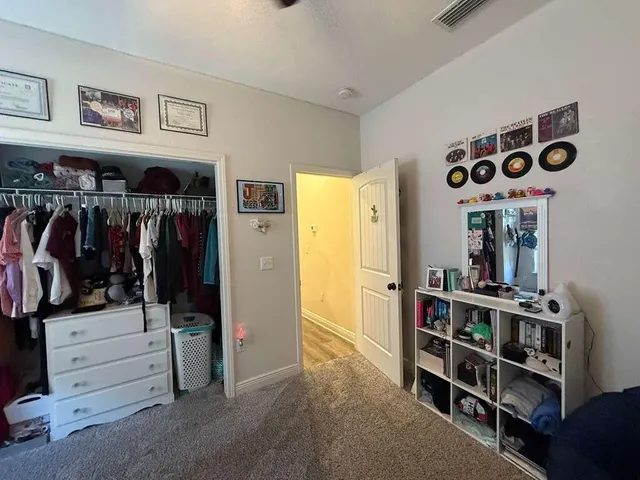 a bedroom with furniture and a chandelier