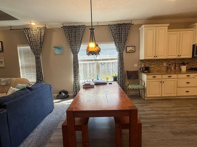 a view of a hallway with a chandelier