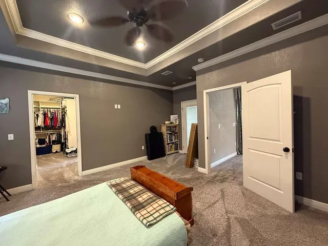 a room with pool table and windows