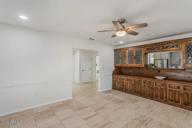 a kitchen with stainless steel appliances granite countertop refrigerator sink and stove