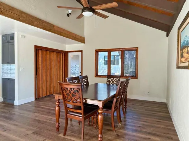 a dining room with furniture and window