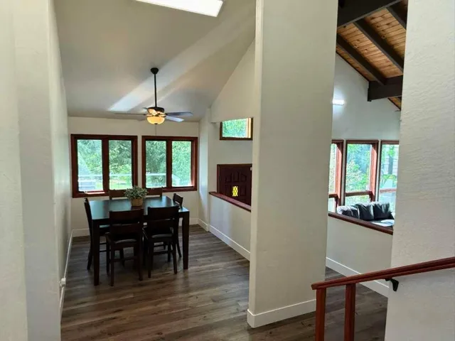 a view of a dining room with furniture window and wooden floor